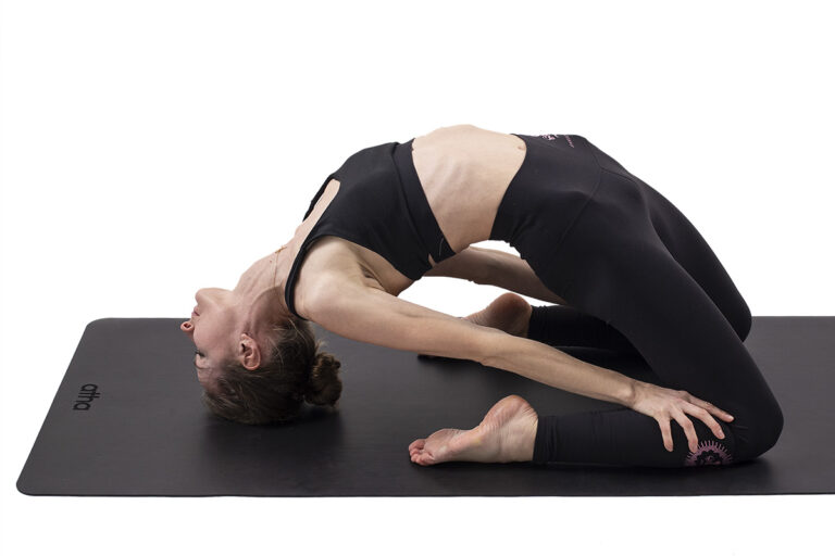 Girl practicing on black atha yoga mat